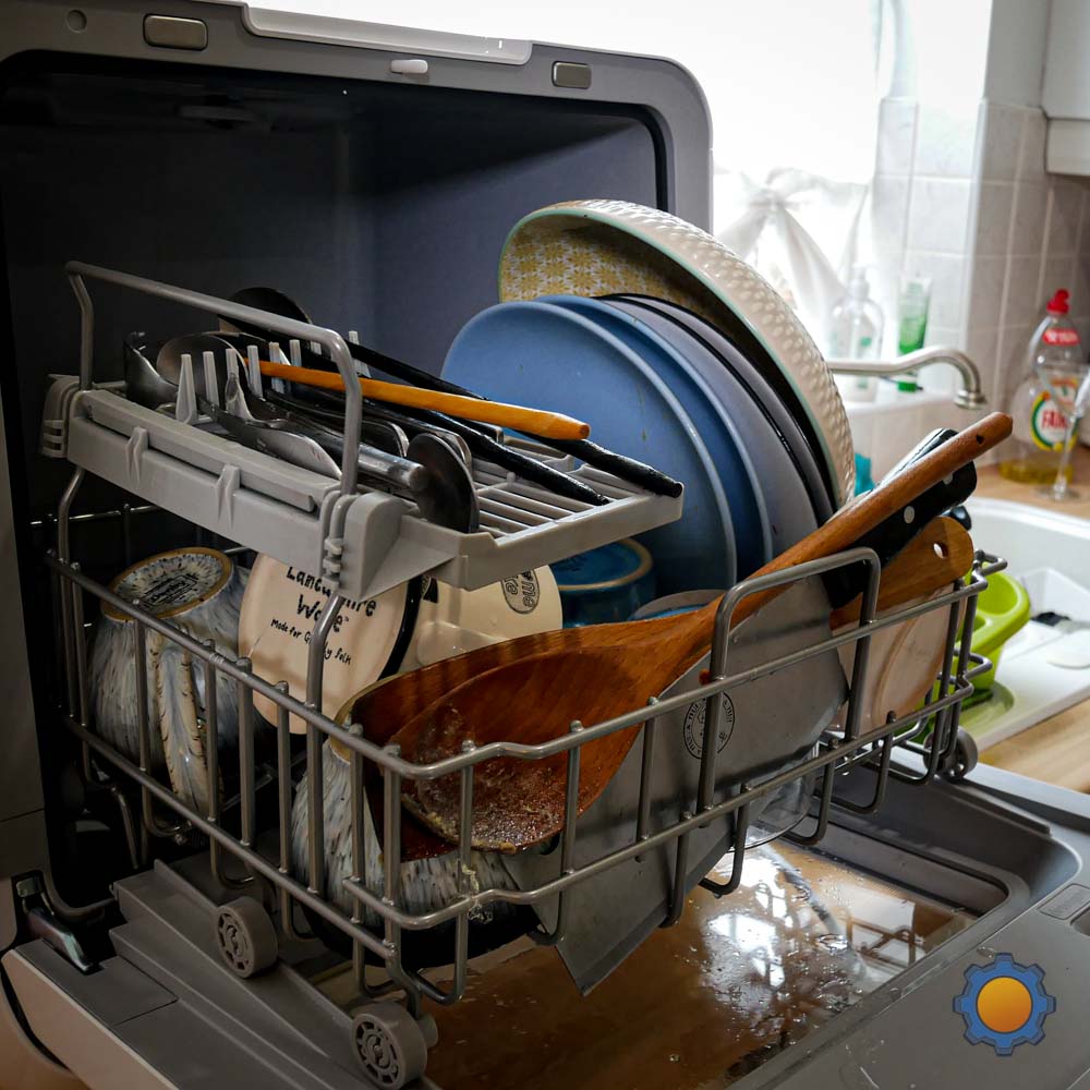 dirty dishes inside the comfee miniplus dishwasher internal basket